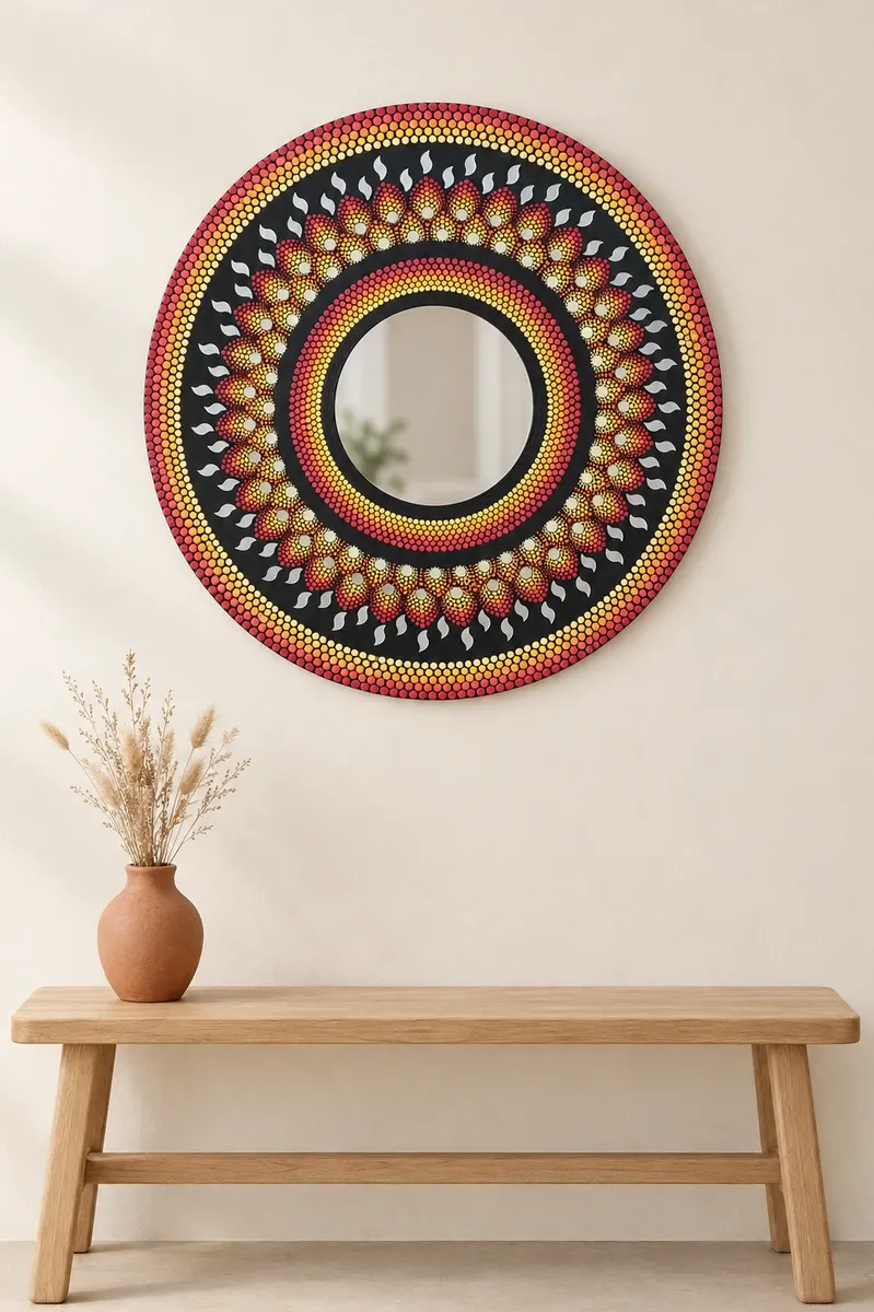 Ember Petal Mirror, 24 inches, hanging above a wooden bench
